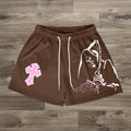 Pantaloncini in rete con stampa del Grim Reaper e croce