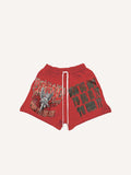 Short met print als nepsticker van engel, pistool en letters, met trekkoord in de taille