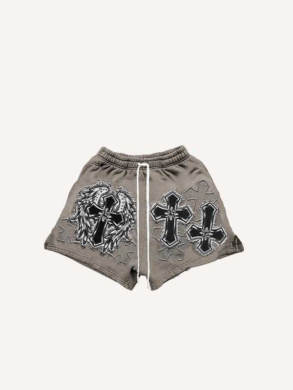 Shorts met kruis-, vleugel- en letterprint, neplaagjes en trekkoord in de taille