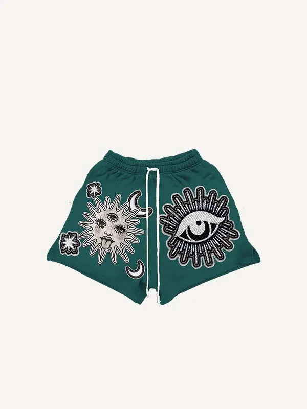 Pantaloncini con coulisse in vita e stampa effetto adesivo finta di sole, luna, occhio e stella