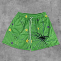 Pantaloncini in mesh con grafiche artistiche di ragno e stella
