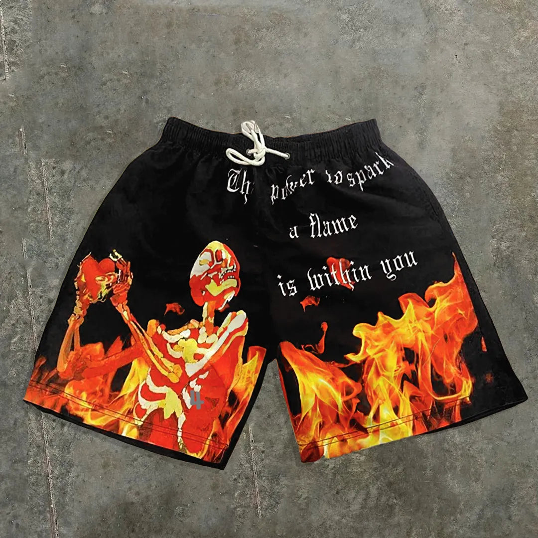 Casual mesh shorts in streetwearstijl met schedelopdruk en de tekst The Power To Spark A Flame Is Within You
