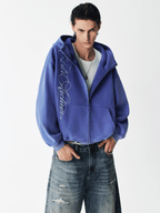 Sweat à capuche zippé à broderie délavée