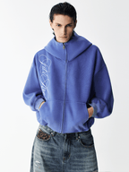 Sweat à capuche zippé à broderie délavée