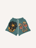 Shorts à taille élastique avec cordon de serrage et imprimés petit diable, aile, nuage et serpent
