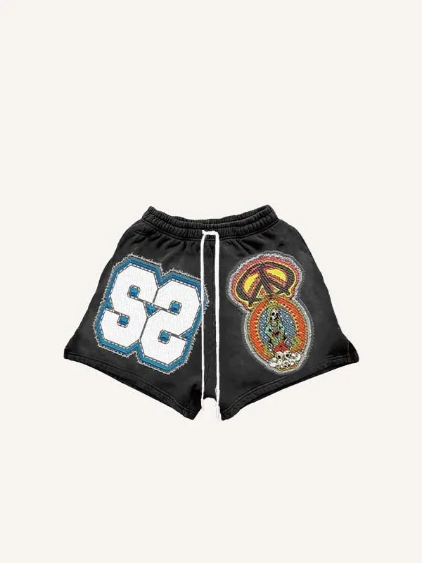 Pantaloncini con coulisse in vita e stampa effetto decalcomania di grafica e scritta