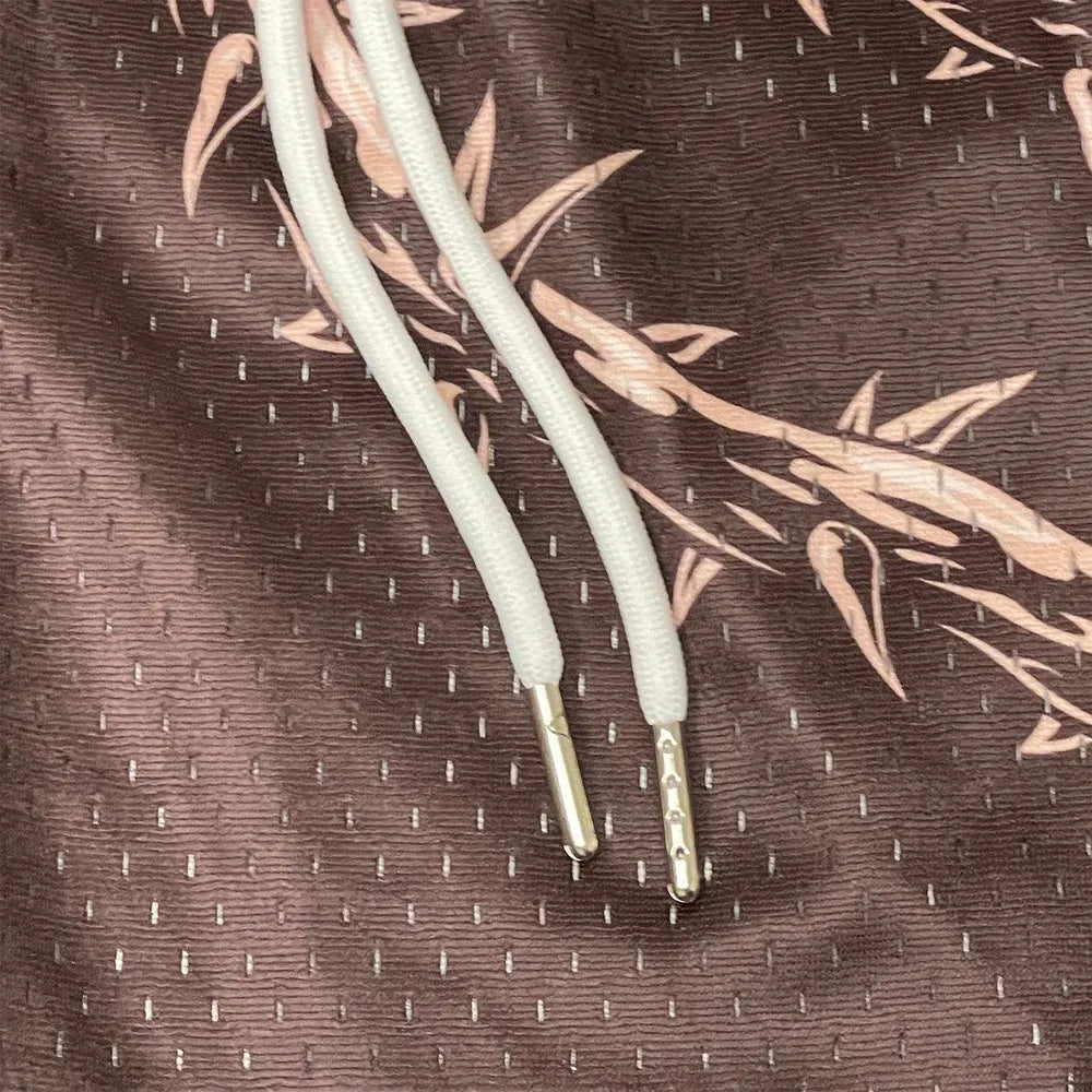 Pantaloncini in mesh con stampa di spine divertenti