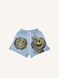 Pantaloncini con coulisse in vita e stampa di faccina sorridente, scheletro e scritta