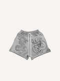 Pantaloncini con coulisse in vita e stampa drago e grafica