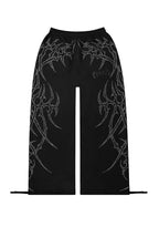 HAUNT PANTALONES DEPORTIVOS OVERSIZE CON TACHUELAS NEGROS