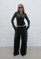 HAUNT PANTALONES DEPORTIVOS OVERSIZE CON TACHUELAS NEGROS
