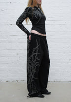 HAUNT PANTALONES DEPORTIVOS OVERSIZE CON TACHUELAS NEGROS