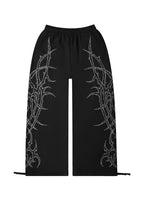 HAUNT PANTALONES DEPORTIVOS OVERSIZE CON TACHUELAS NEGROS
