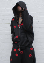 TEASE SUDADERA CON CAPUCHA Y CREMALLERA, CON BESOS DE STRASS, NEGRA