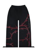 PANTALÓN DE CHÁNDAL THORN CON PEDRERÍA NEGRO Y ROJO